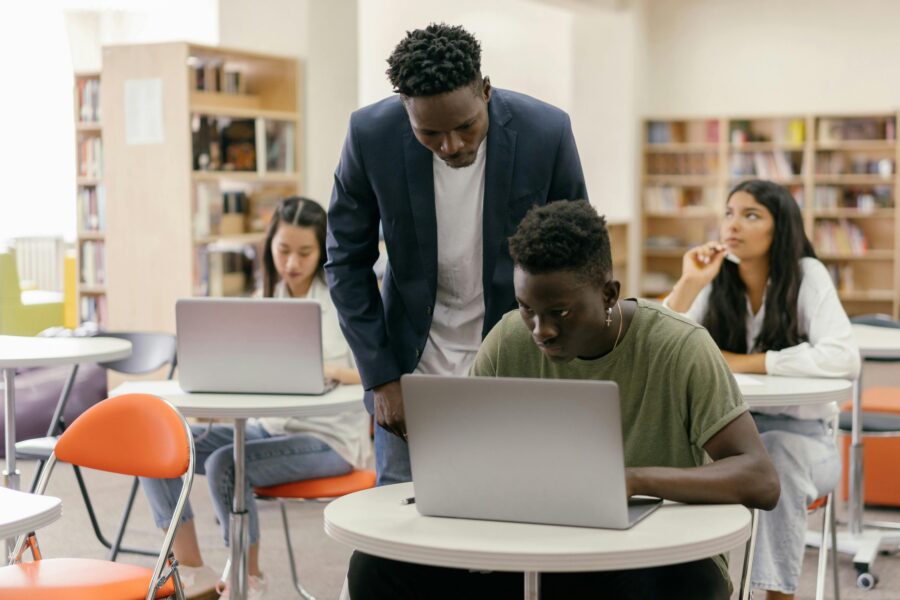 College Professor reviewing students work